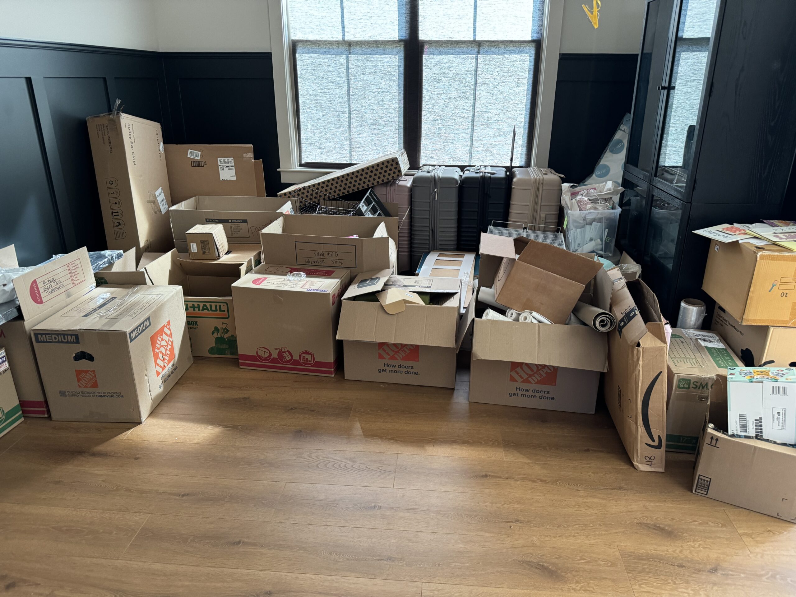 unpacked boxes in living room